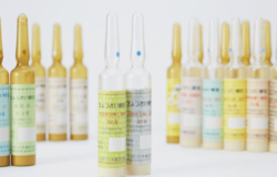Colorful ampules of sake yeast on a white backdrop.