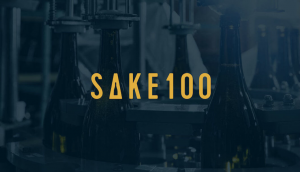 The SAKE100 logo. The “A” enshrines the image of a sake bottle, while Ikoma says the “100” is to invoke a sake that won’t lose its luster, even over 100 years’ time.